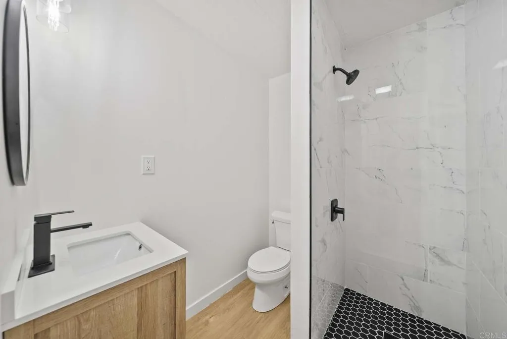 8301 Mission Gorge Road, Unit 253 Santee, CA 92071 - Photo 24 of 40 a bathroom with a sink toilet and shower