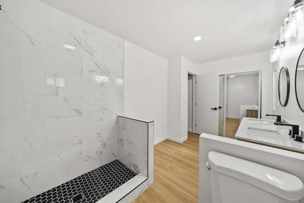 8301 Mission Gorge Road, Unit 253 Santee, CA 92071 - Photo 26 of 40 a bathroom with a sink toilet and shower