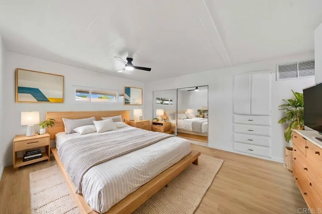 8301 Mission Gorge Road, Unit 253 Santee, CA 92071 - Photo 3 of 40 a spacious bedroom with a bed and a dresser in it