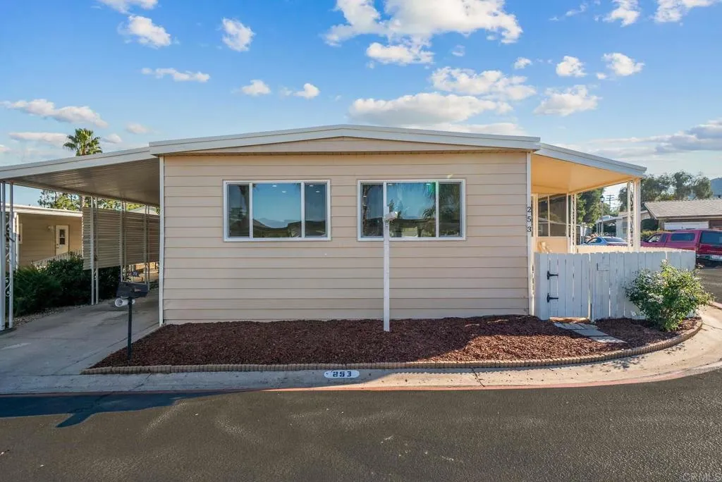 8301 Mission Gorge Road, Unit 253 Santee, CA 92071 - Photo 37 of 40 a front view of a house with a yard