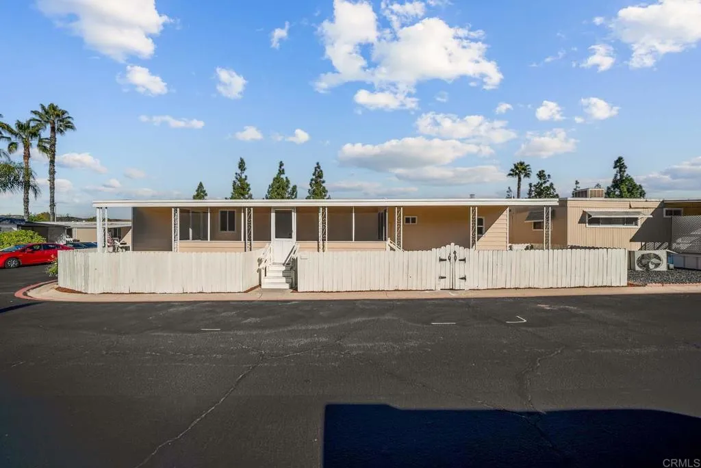 8301 Mission Gorge Road, Unit 253 Santee, CA 92071 - Photo 39 of 40 a view of swimming pool with a yard in back
