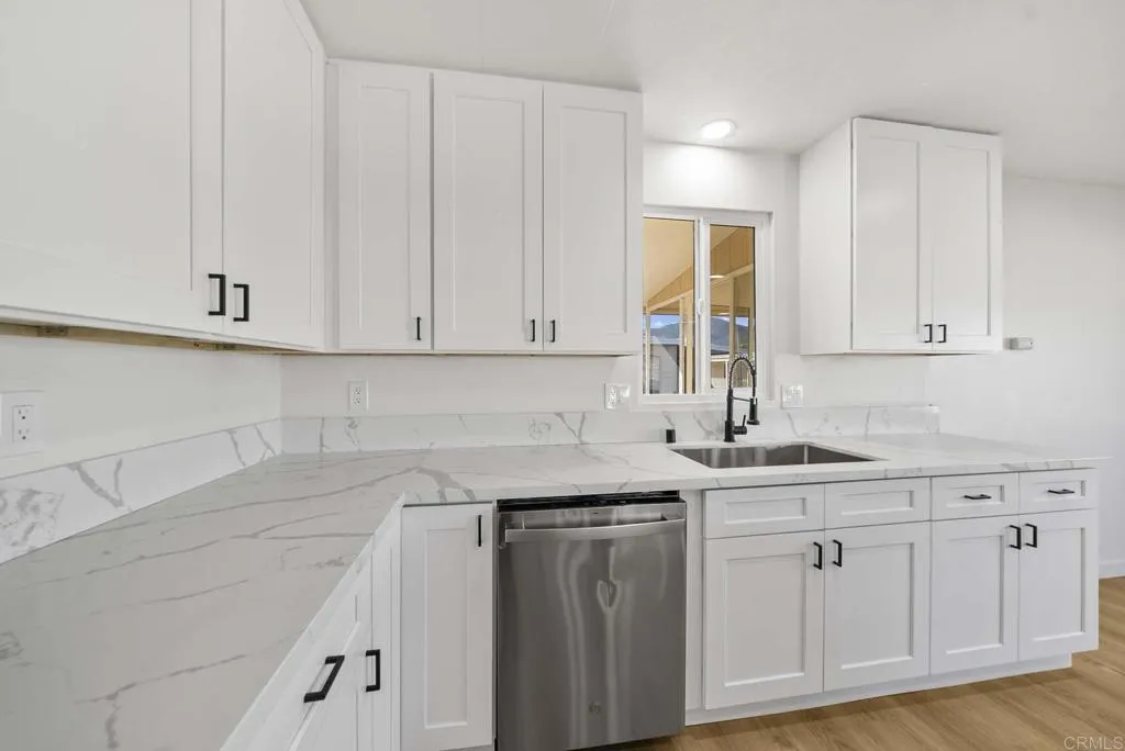 8301 Mission Gorge Road, Unit 253 Santee, CA 92071 - Photo 8 of 40 a kitchen with white cabinets