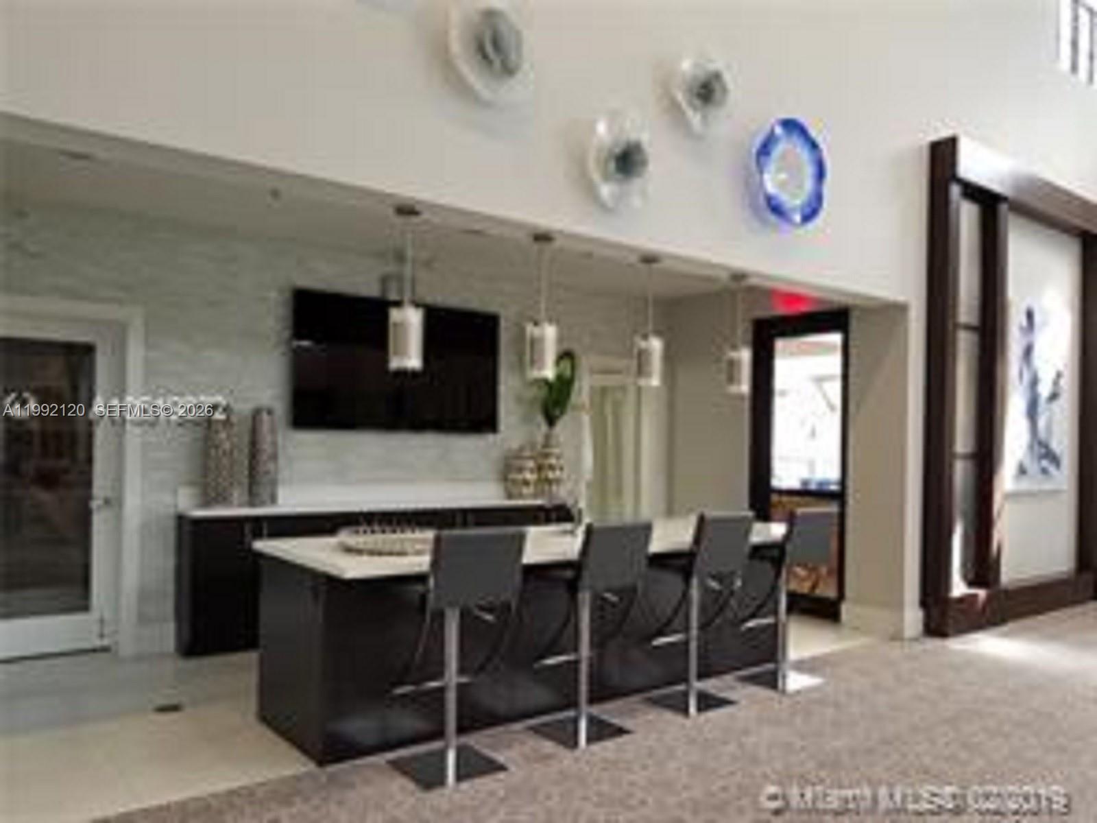 17000 Southwest 90th Terrace Miami, FL 33196 - Photo 44 of 56 a kitchen with a table and chairs in it
