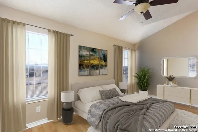 a bedroom with a large bed and a window