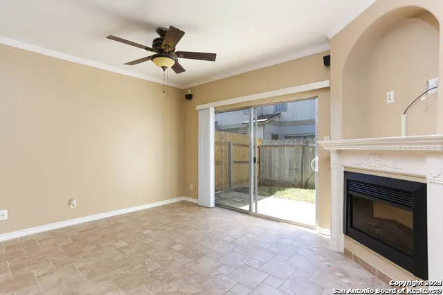 a view of an empty room with a fireplace