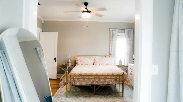 a bedroom with a bed and a window