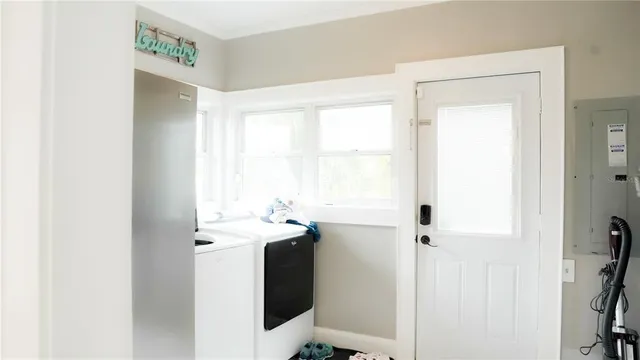a utility room with a window dryer and washer