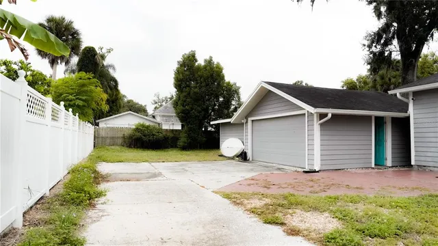 a backyard of a house with yard and garage