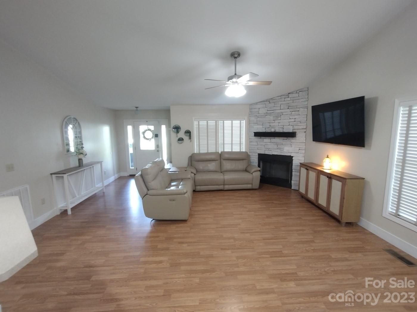 80 South Sunset Ridge Drive Etowah, NC 28729 - Photo 14 of 48 a living room with furniture and a flat screen tv
