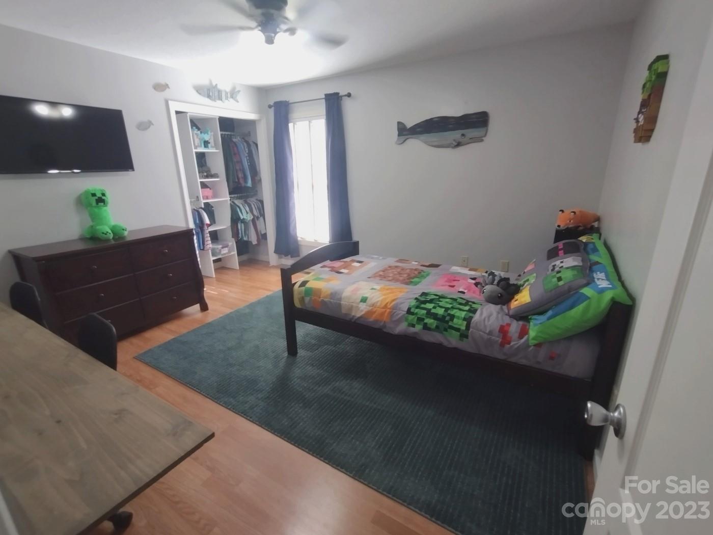 80 South Sunset Ridge Drive Etowah, NC 28729 - Photo 21 of 48 a living room with furniture and a potted plant