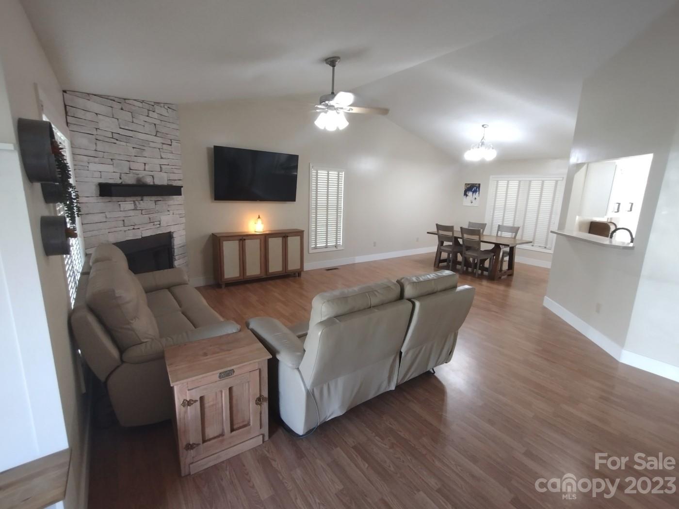 80 South Sunset Ridge Drive Etowah, NC 28729 - Photo 3 of 48 a living room with furniture and a flat screen tv