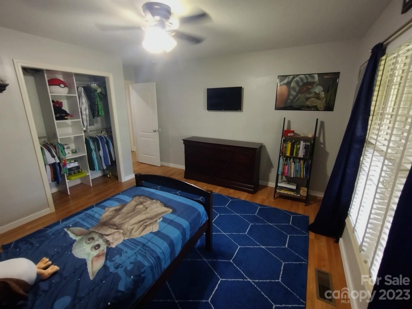 80 South Sunset Ridge Drive Etowah, NC 28729 - Photo 34 of 48 a living room with furniture and a flat screen tv