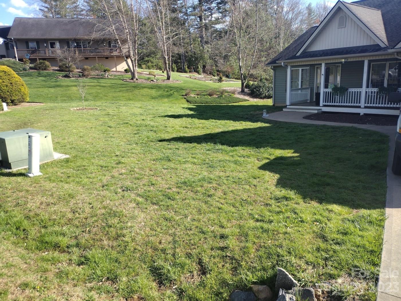 80 South Sunset Ridge Drive Etowah, NC 28729 - Photo 36 of 48 a view of a house with a yard