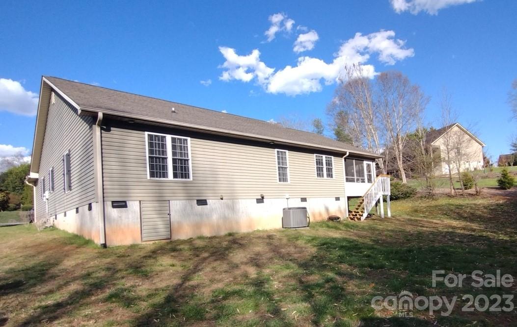 80 South Sunset Ridge Drive Etowah, NC 28729 - Photo 40 of 48 a view of a house with a yard