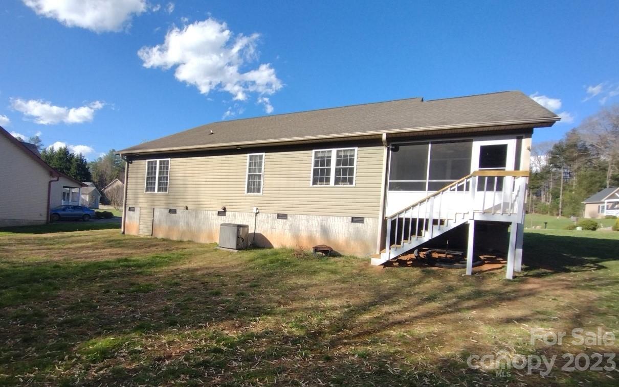 80 South Sunset Ridge Drive Etowah, NC 28729 - Photo 41 of 48 a view of a house with a yard