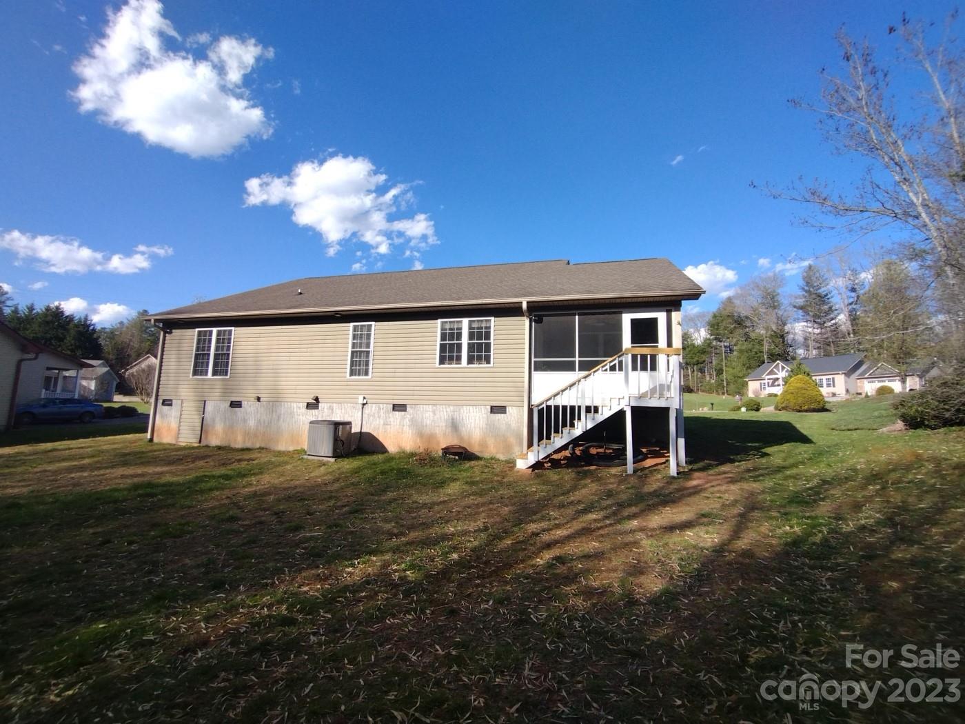 80 South Sunset Ridge Drive Etowah, NC 28729 - Photo 43 of 48 a view of a house with a yard