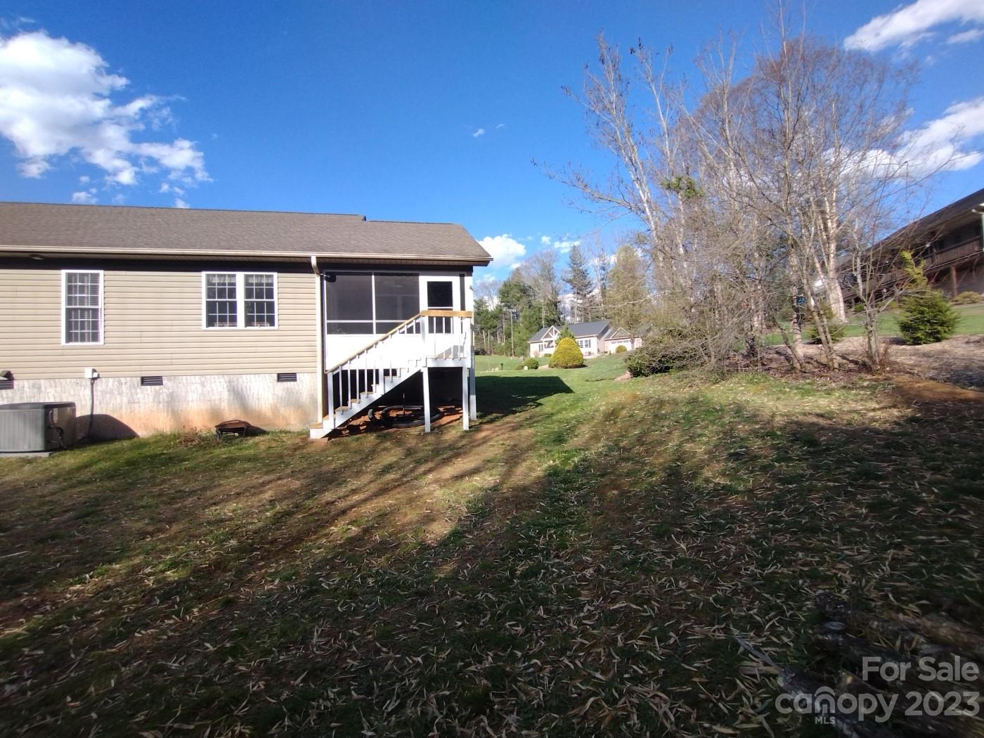 80 South Sunset Ridge Drive Etowah, NC 28729 - Photo 44 of 48 a view of a house with a yard