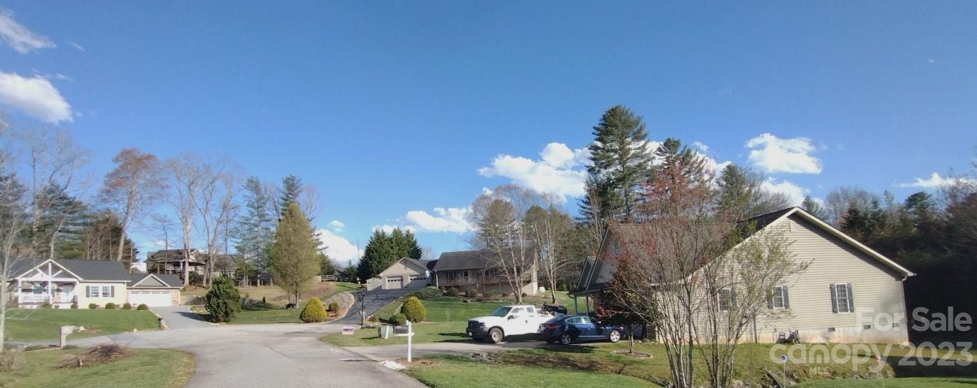 80 South Sunset Ridge Drive Etowah, NC 28729 - Photo 48 of 48 a view of a house with a yard