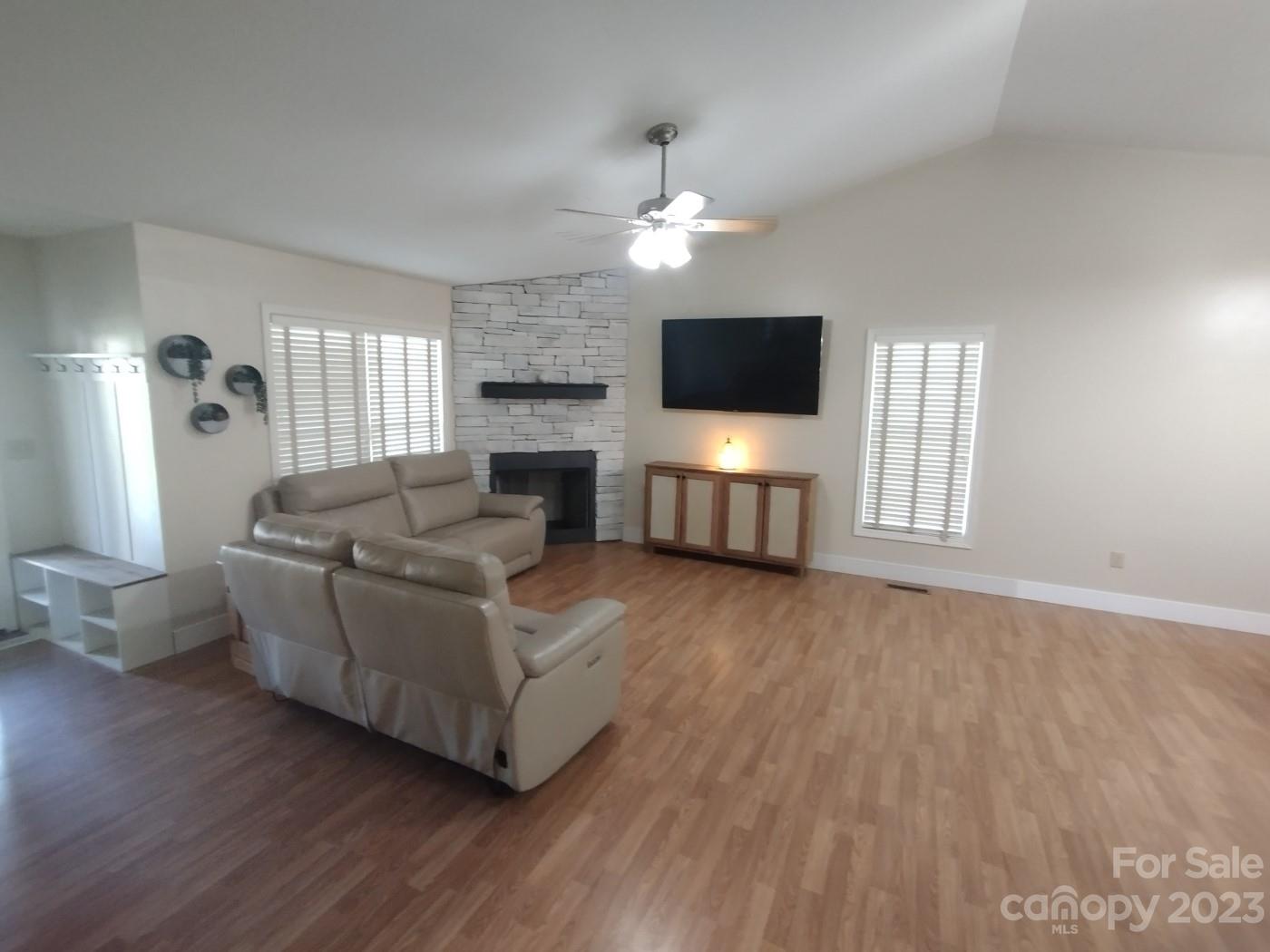 80 South Sunset Ridge Drive Etowah, NC 28729 - Photo 5 of 48 a living room with furniture and a flat screen tv