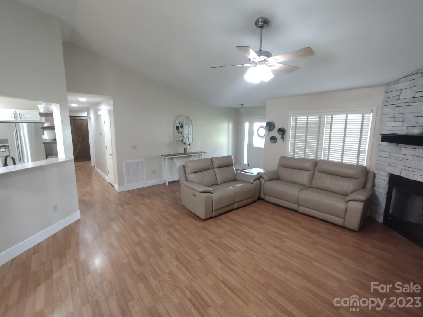 80 South Sunset Ridge Drive Etowah, NC 28729 - Photo 6 of 48 a living room with furniture and a chandelier