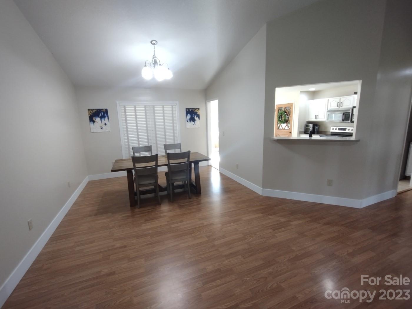 80 South Sunset Ridge Drive Etowah, NC 28729 - Photo 7 of 48 a view of a livingroom with furniture wooden floor and a window