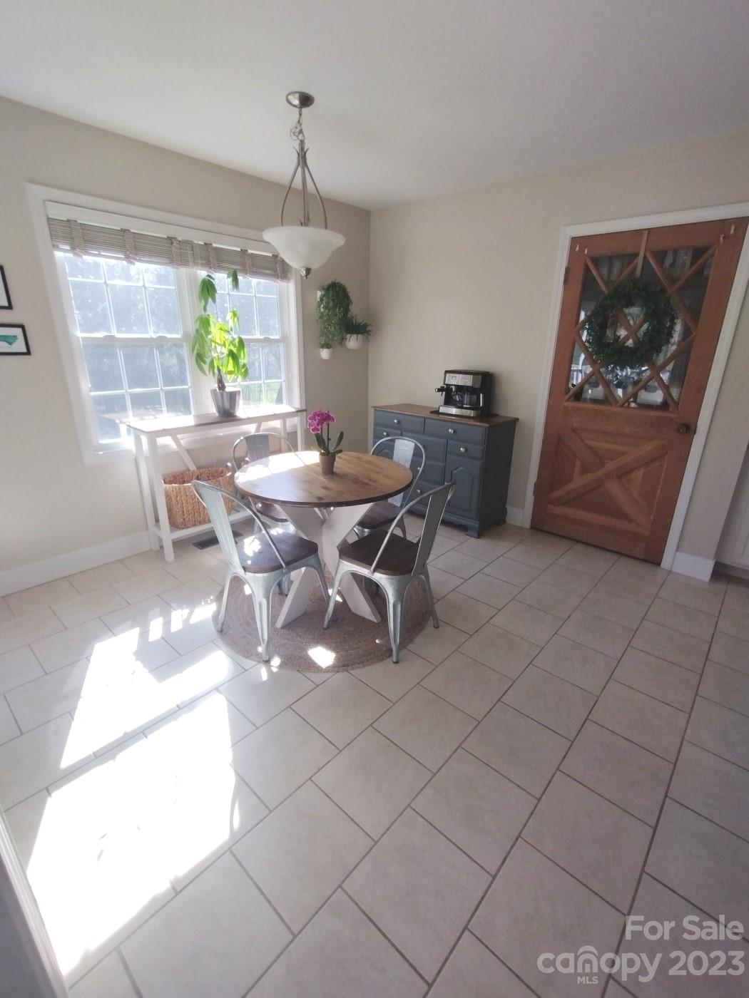 80 South Sunset Ridge Drive Etowah, NC 28729 - Photo 8 of 48 a view of a dining room with furniture