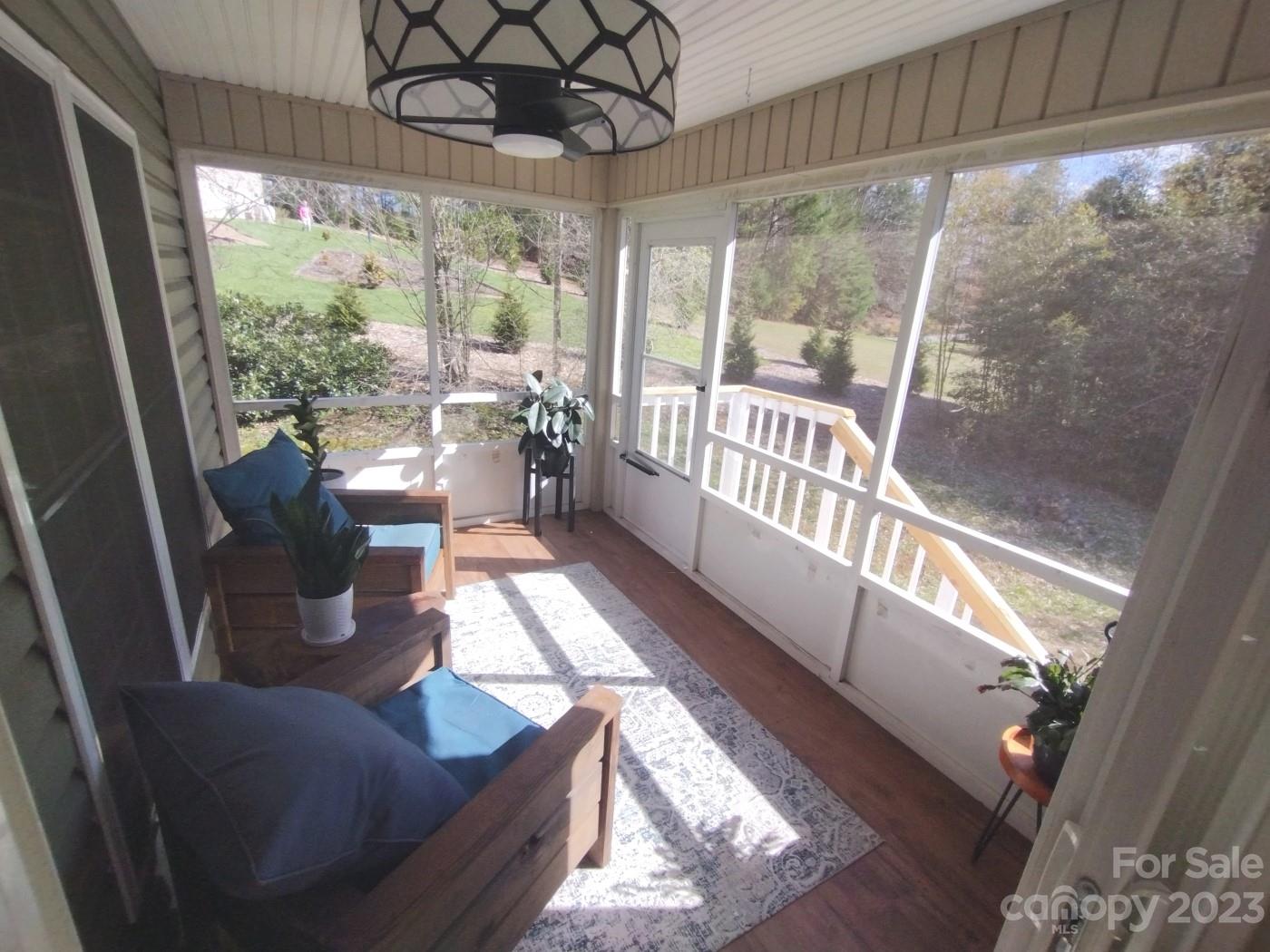 80 South Sunset Ridge Drive Etowah, NC 28729 - Photo 10 of 48 a living room with furniture and a large window