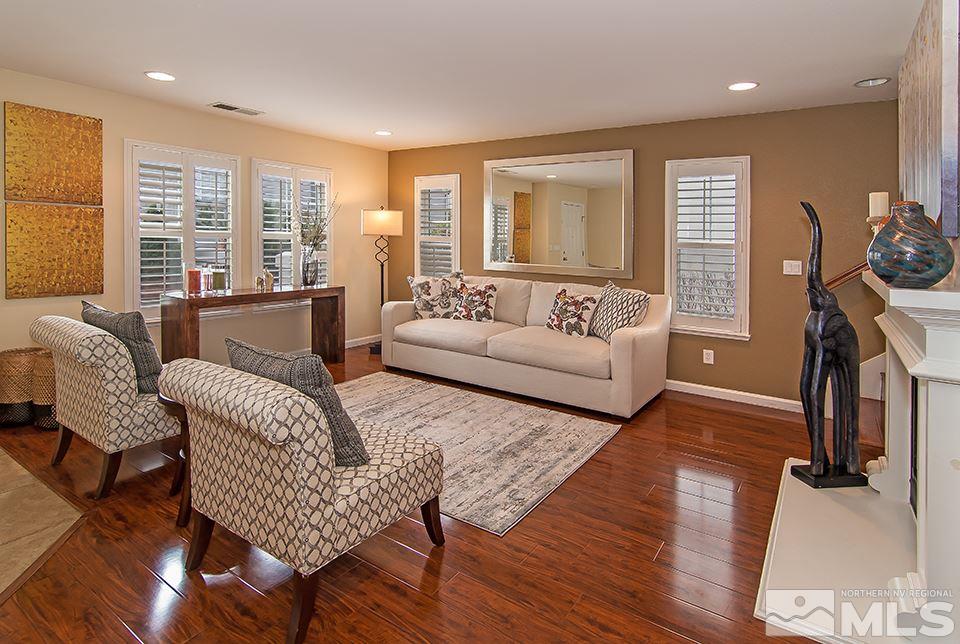 7676 Pebblestone Way Reno, NV 89523 - Photo 5 of 20 a living room with furniture and a flat screen tv