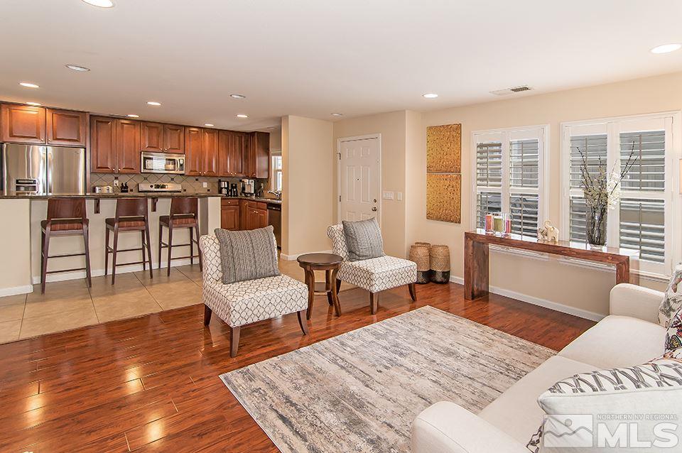 7676 Pebblestone Way Reno, NV 89523 - Photo 6 of 20 a living room with furniture and a table