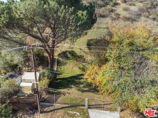 a backyard of a house with large trees