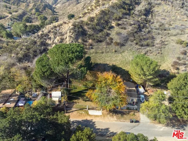 a aerial view of a house with a yard