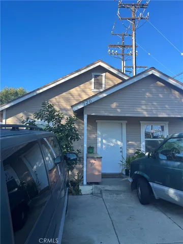 a view of a car park in front of house