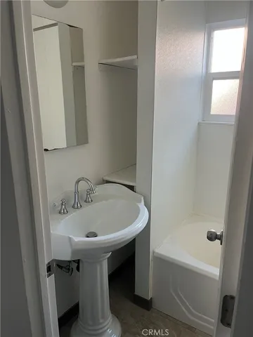 a bathroom with a sink and a bathtub