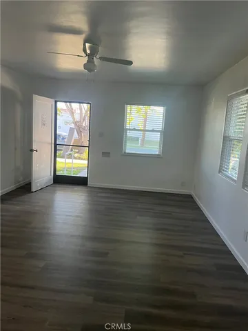 a backyard of a house with barbeque oven