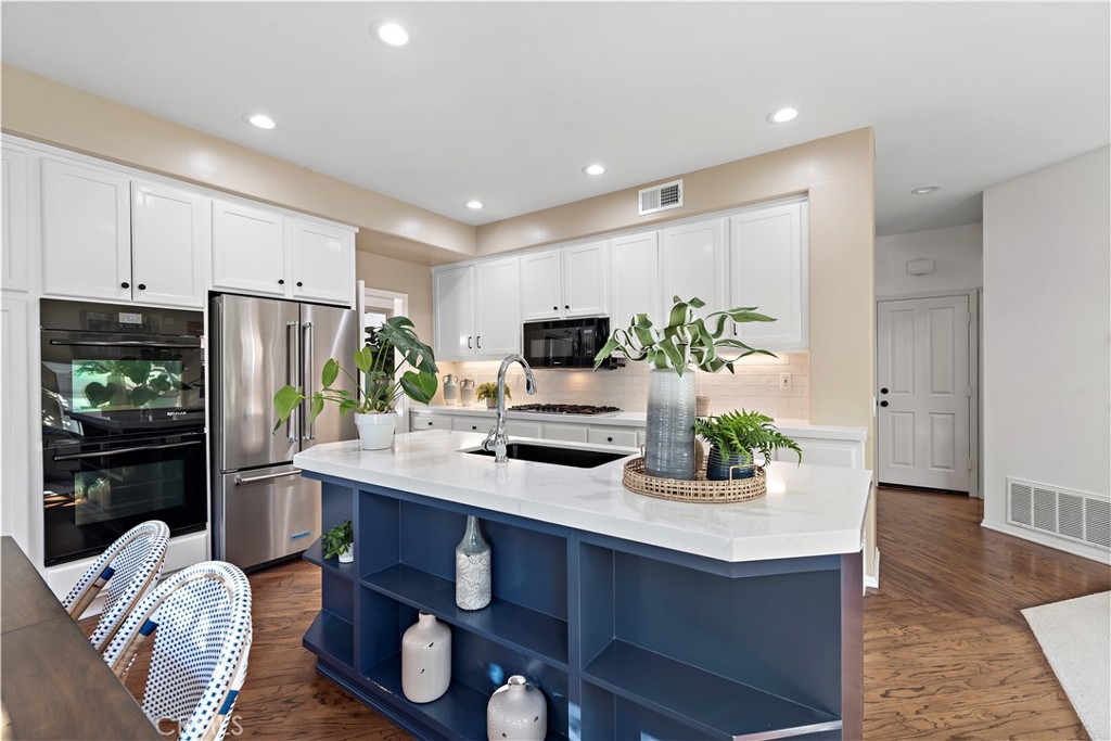 16 Clermont Newport Coast, CA 92657 - Photo 11 of 29 a kitchen with stainless steel appliances granite countertop a refrigerator and a stove top oven