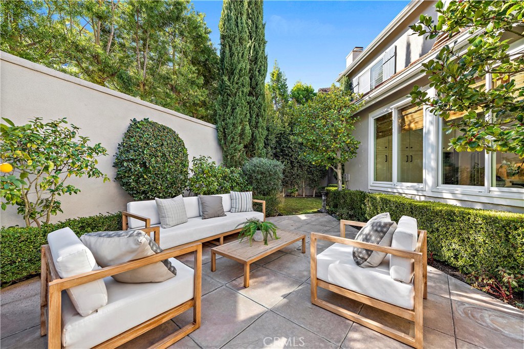 16 Clermont Newport Coast, CA 92657 - Photo 17 of 29 a view of backyard of house with outdoor seating and green space