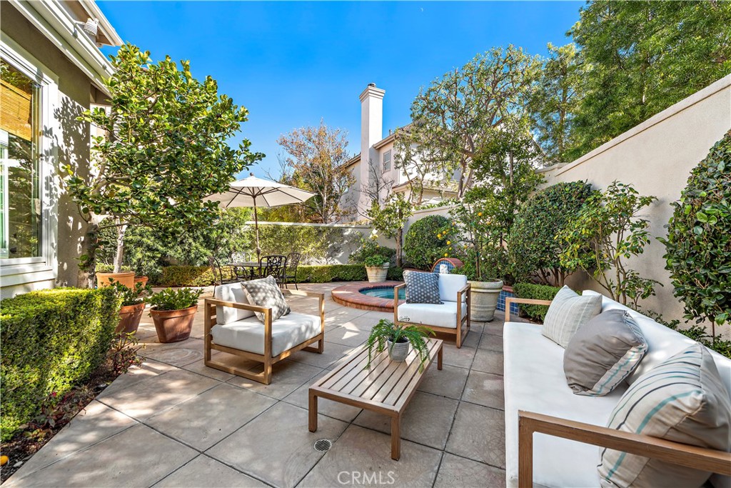 16 Clermont Newport Coast, CA 92657 - Photo 18 of 29 a view of a patio with couches table and chairs and potted plants