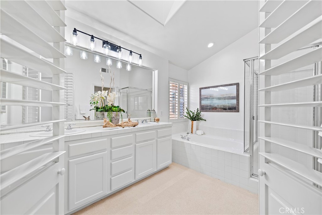 16 Clermont Newport Coast, CA 92657 - Photo 23 of 29 a bathroom with a tub sink and mirror