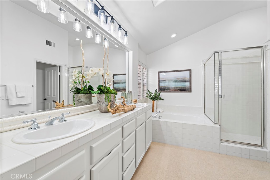 16 Clermont Newport Coast, CA 92657 - Photo 24 of 29 a bathroom with a tub a sink and mirror