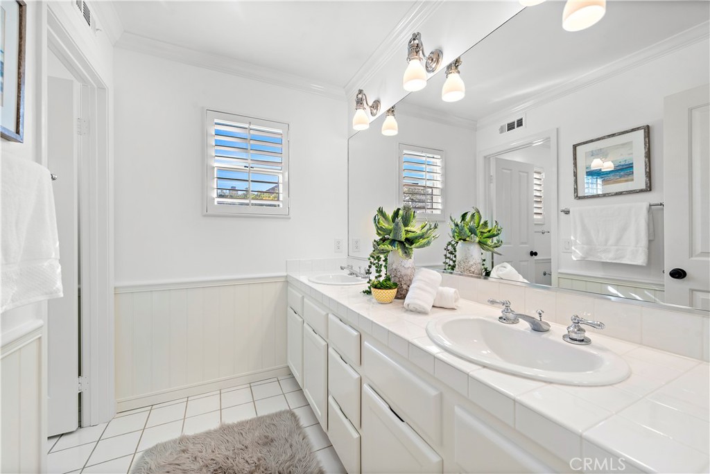 16 Clermont Newport Coast, CA 92657 - Photo 28 of 29 a bathroom with a sink a vanity and a mirror