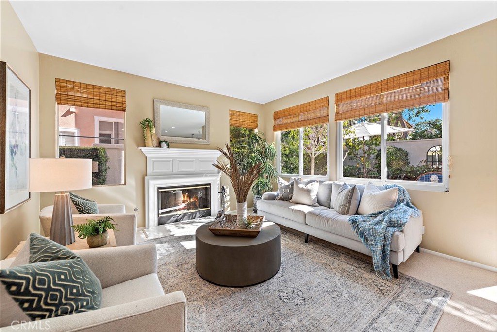 16 Clermont Newport Coast, CA 92657 - Photo 7 of 29 a living room with furniture a fireplace and a large window