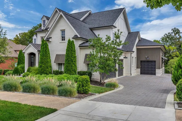 a front view of a house with a garage