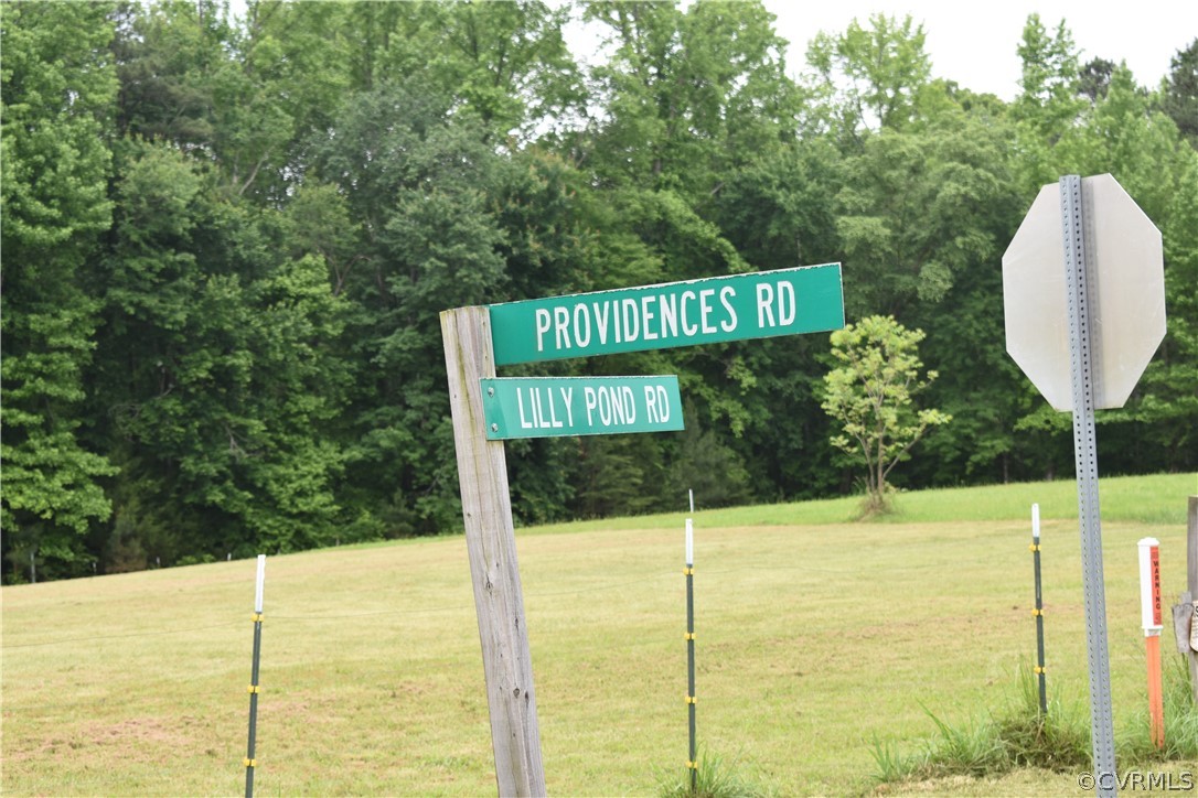 0 Southeast Lilly Pond Road Center Cross, VA 22437 - Photo 1 of 10 Community sign with a yard