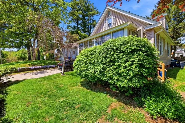 a front view of a house with garden