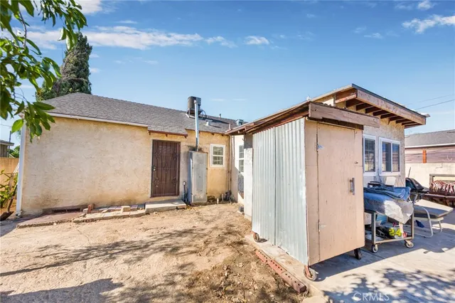 a view of a house with a snow in the background