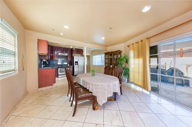 a dining room with furniture and window