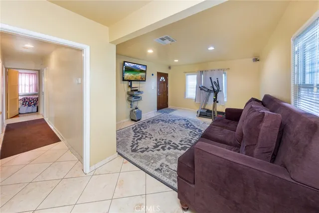 a living room with furniture and a rug