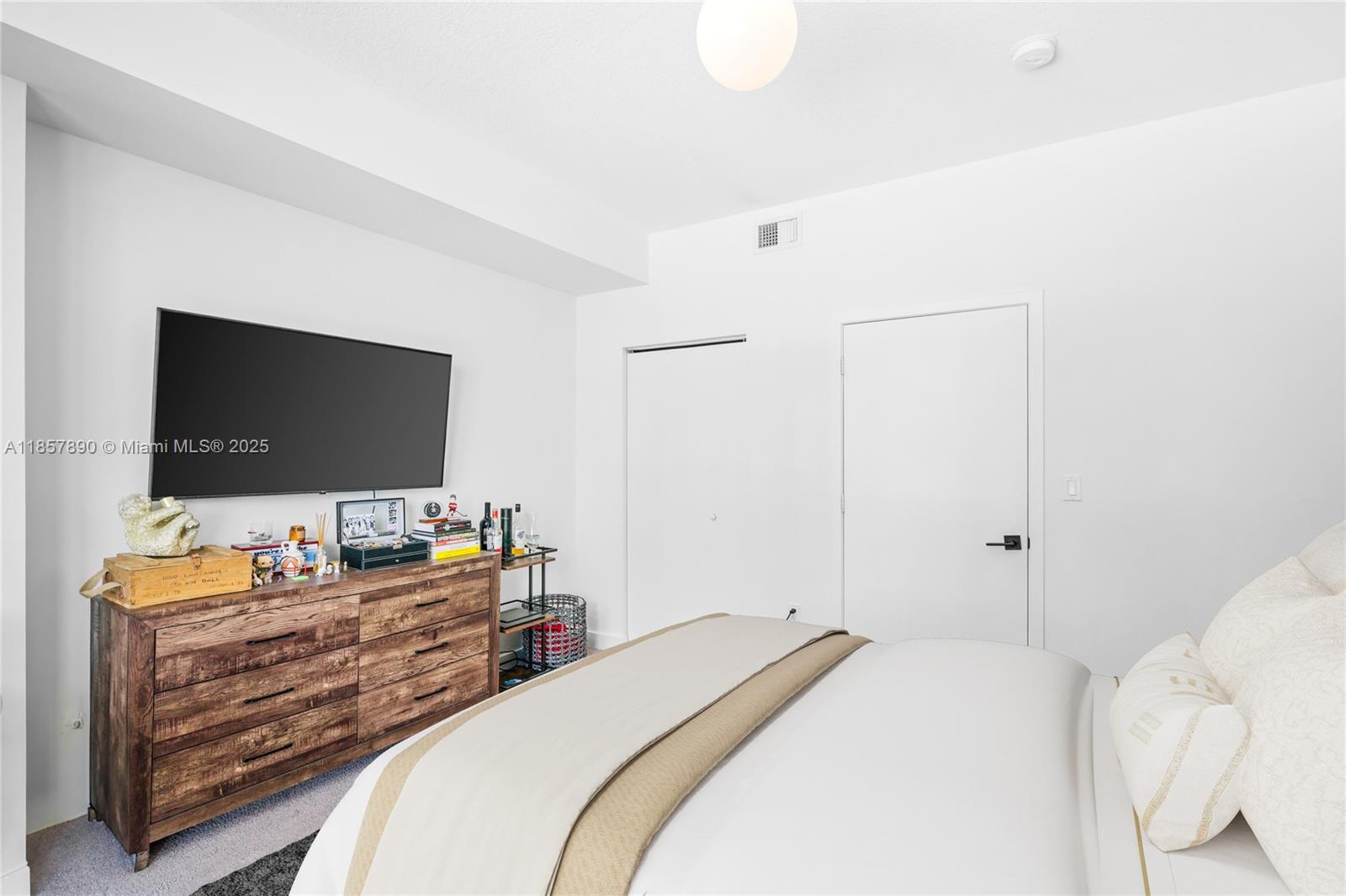 1111 Southwest 1st Avenue, Unit 2222N Miami, FL 33130 - Photo 17 of 53 a bedroom with a bed and a flat screen tv