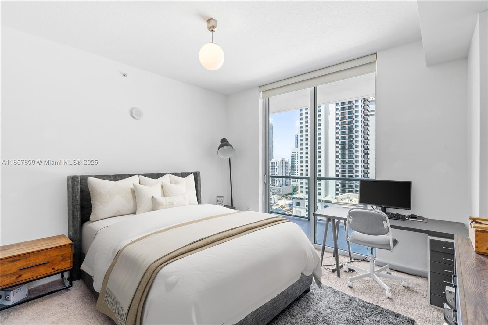 1111 Southwest 1st Avenue, Unit 2222N Miami, FL 33130 - Photo 18 of 53 a bedroom with a bed and a desk