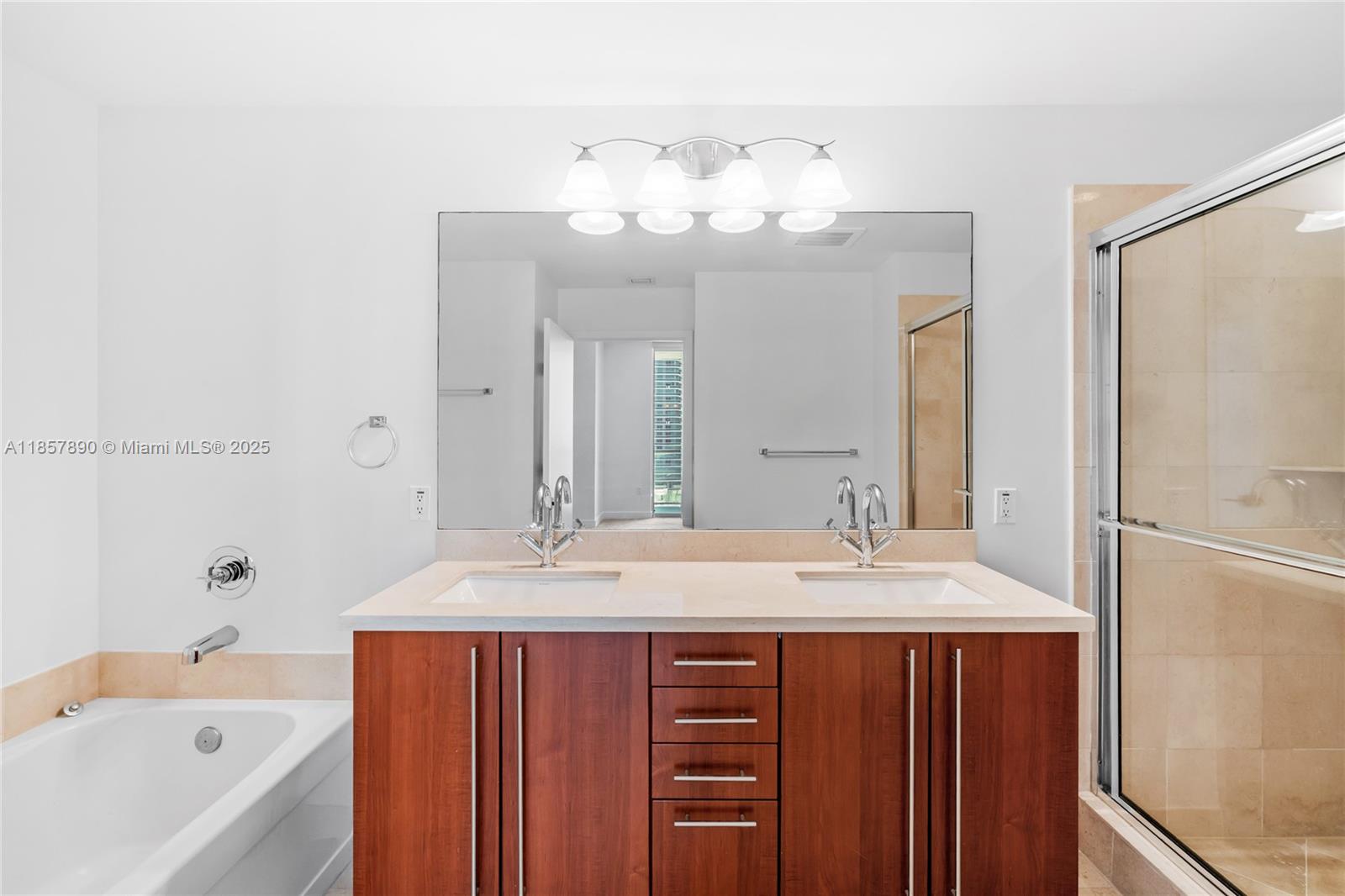 1111 Southwest 1st Avenue, Unit 2222N Miami, FL 33130 - Photo 19 of 53 a bathroom with a tub sink and mirror